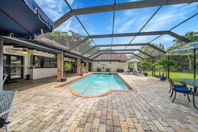 7706 SW 74th Ln, Miami, FL 33143 - pool with a ceiling fan, a patio, and glass enclosure