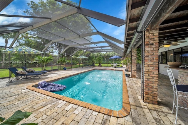 7706 SW 74th Ln, Miami, FL 33143 - pool with ceiling fan, glass enclosure, and a patio