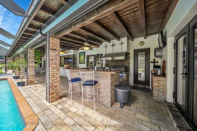 7706 SW 74th Ln, Miami, FL 33143 - view of patio / terrace featuring an outdoor pool, ceiling fan, outdoor wet bar, and a lanai