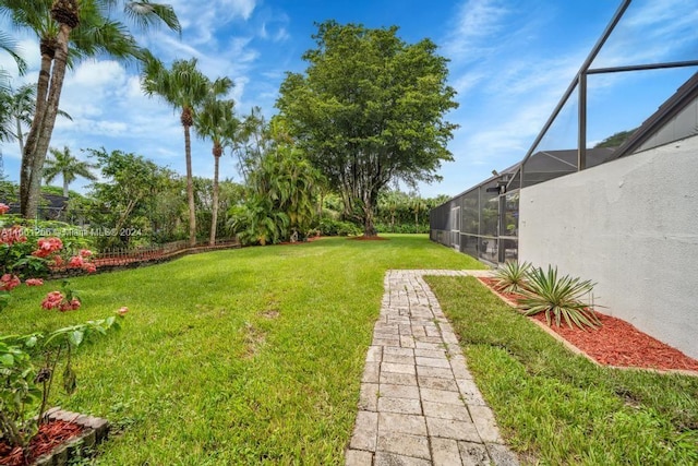 7706 SW 74th Ln, Miami, FL 33143 - view of yard featuring glass enclosure