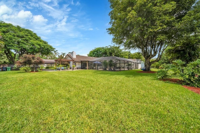 7706 SW 74th Ln, Miami, FL 33143 - view of yard featuring glass enclosure