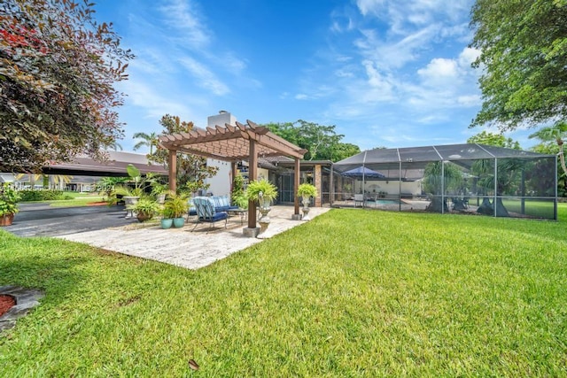 view of yard with a patio, glass enclosure, and a pergola