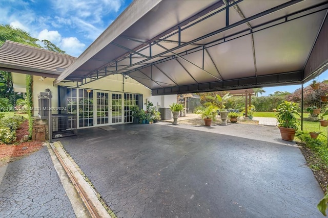 7706 SW 74th Ln, Miami, FL 33143 - view of parking with a carport