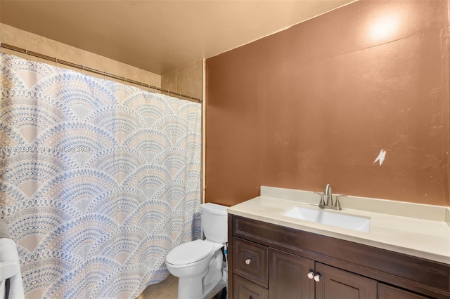 bathroom with vanity, toilet, and a shower with curtain