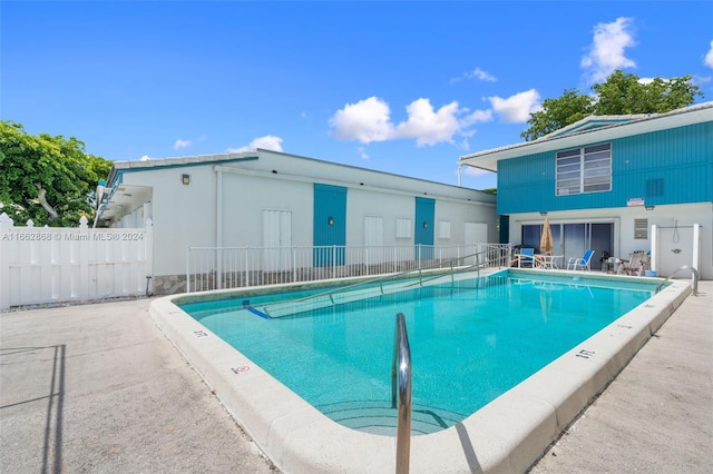 view of pool featuring a patio