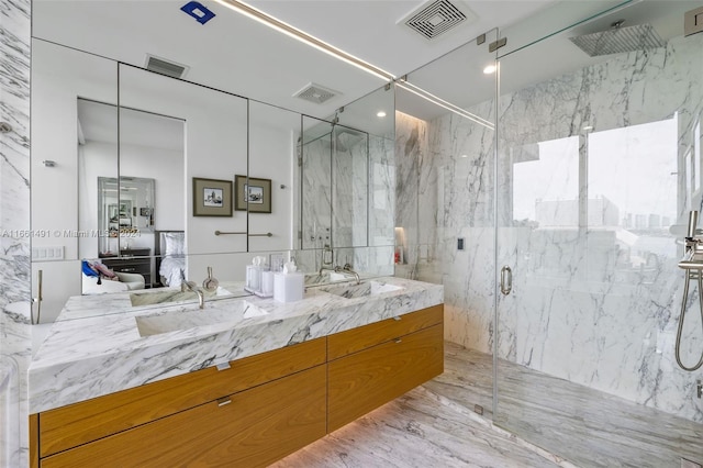 bathroom featuring vanity, tile walls, and a shower with door