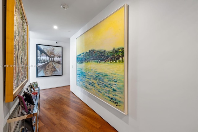 hallway with dark hardwood / wood-style floors