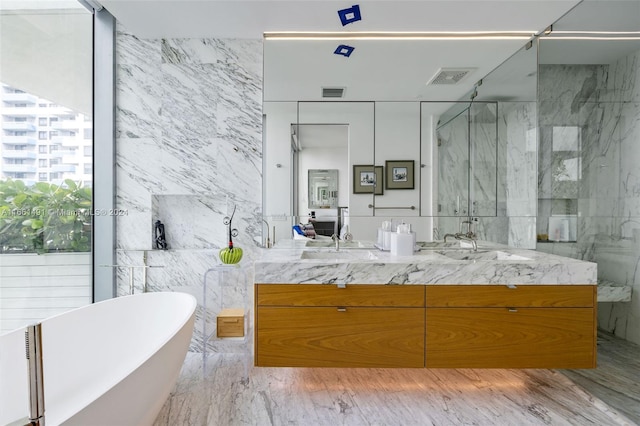 bathroom with plus walk in shower, tile walls, hardwood / wood-style flooring, and vanity