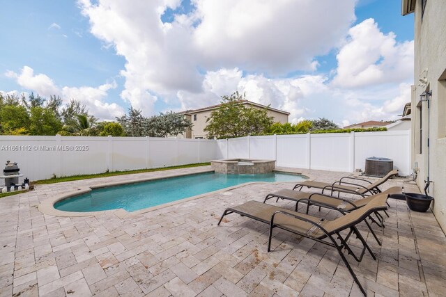 rear view of house featuring a fenced in pool, a yard, a patio area, and central AC