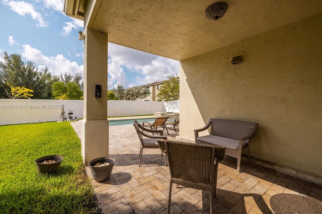 view of pool with an in ground hot tub, a patio area, and central air condition unit