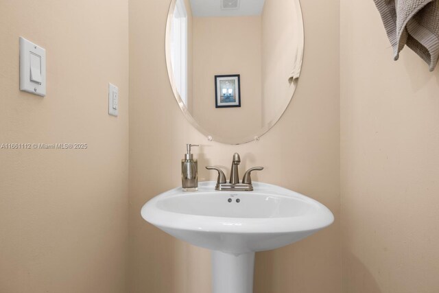 bathroom with vanity and tile patterned floors