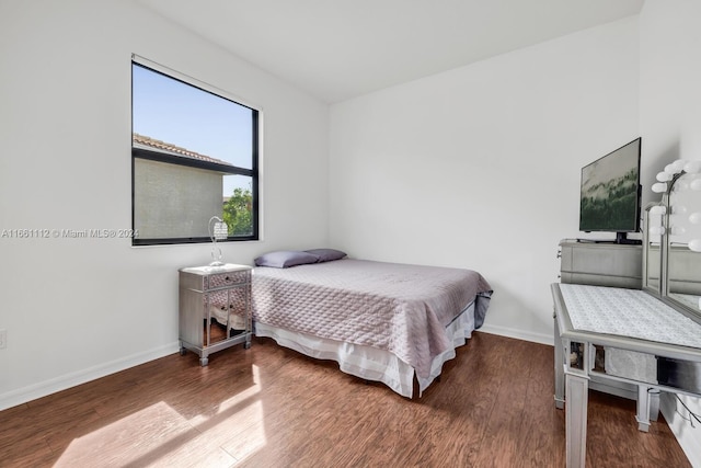 bedroom with wood-type flooring