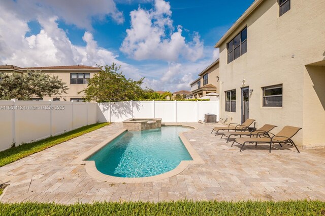 view of swimming pool featuring cooling unit and a patio area