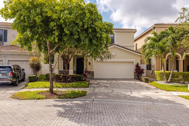 mediterranean / spanish house with a garage