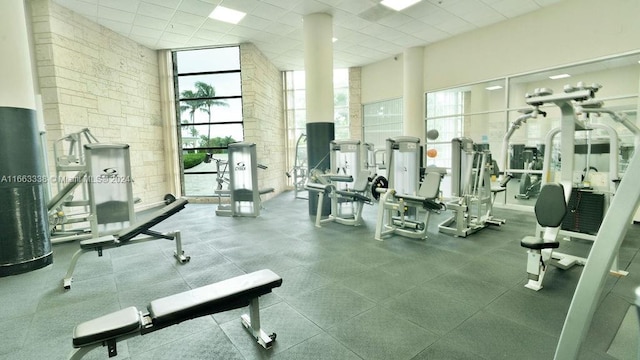 gym featuring a paneled ceiling