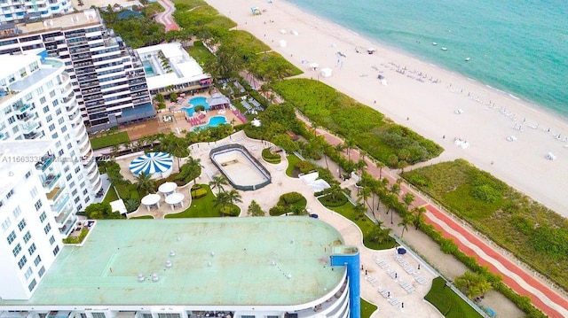 bird's eye view featuring a view of the beach and a water view