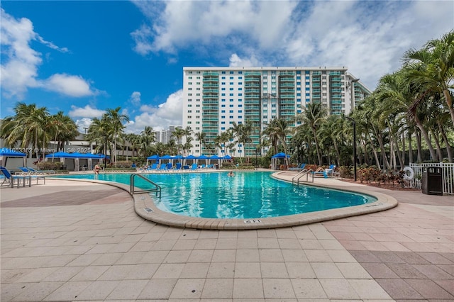 view of swimming pool featuring a patio area