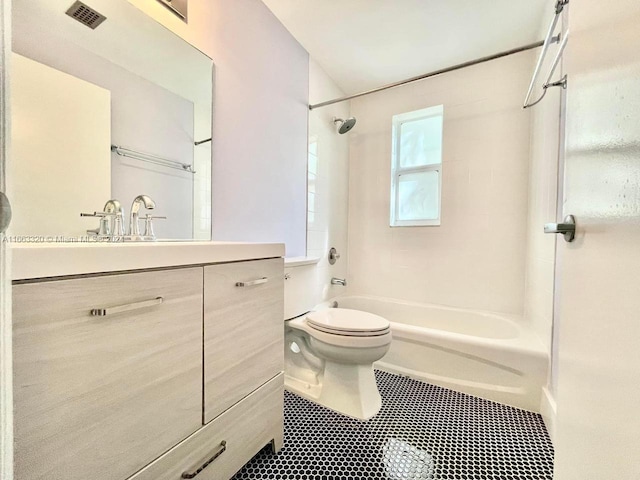 full bathroom with toilet, vanity, and tiled shower / bath combo