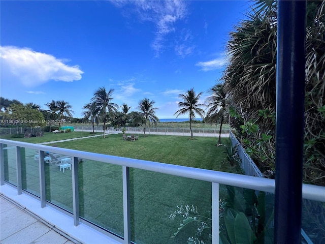 balcony featuring a water view