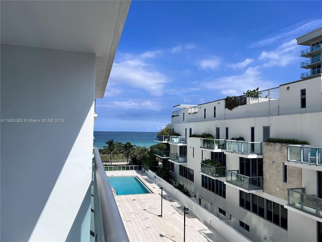 balcony featuring a water view