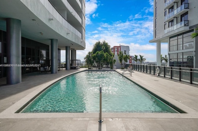 community pool featuring a patio