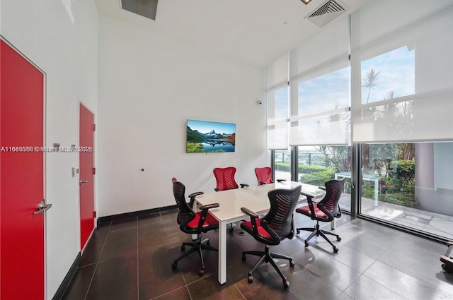 office featuring baseboards and visible vents