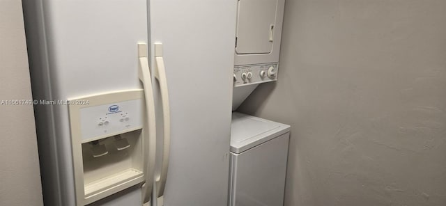 laundry area with stacked washer and clothes dryer