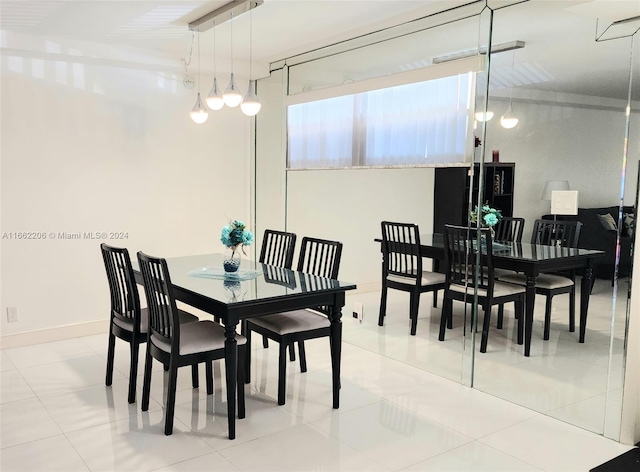 dining space featuring tile patterned floors