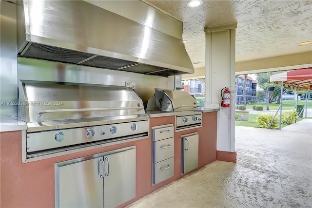 exterior space with wall chimney range hood