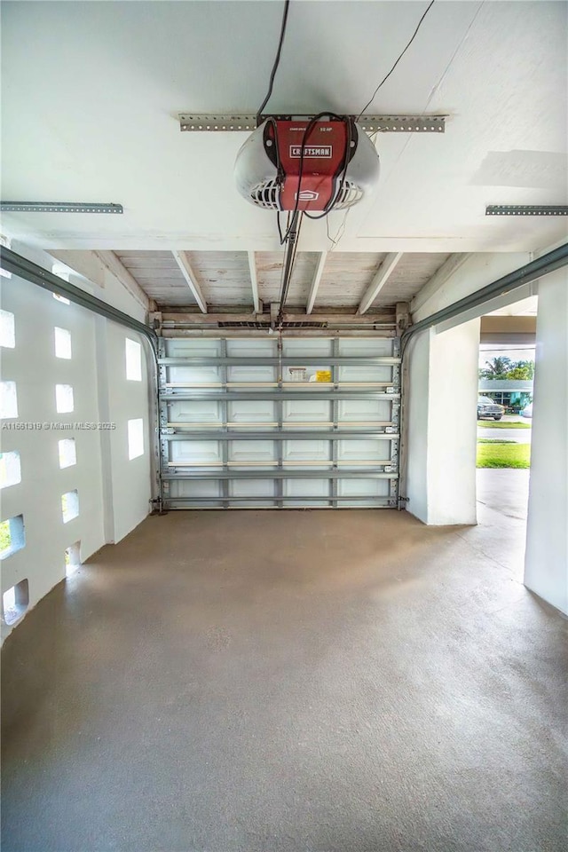 garage featuring a garage door opener