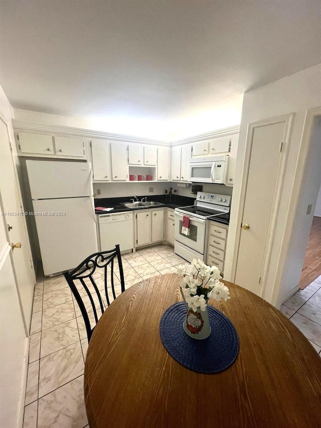 kitchen with white appliances and sink