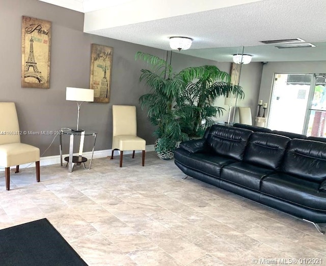 living room with a textured ceiling