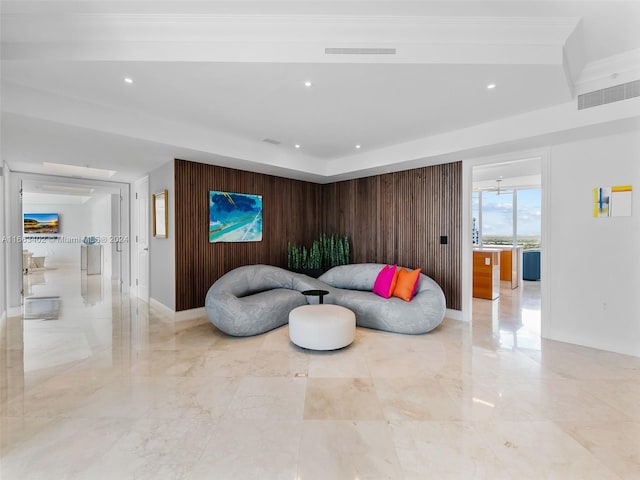 living room with wood walls