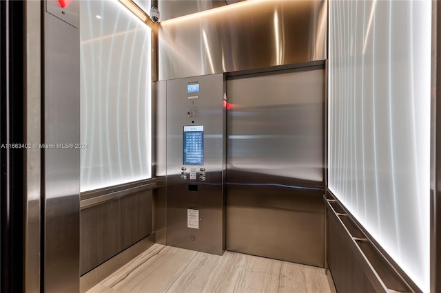 room details featuring elevator and hardwood / wood-style flooring