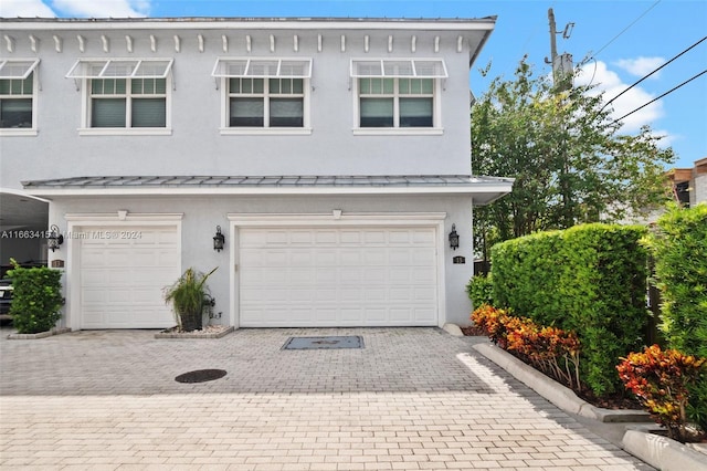 view of front of property featuring a garage