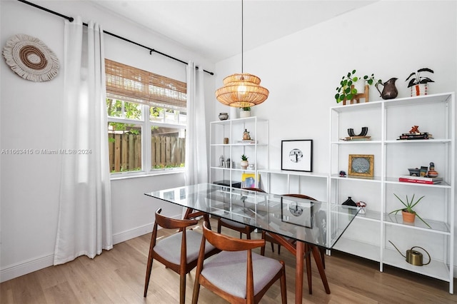 dining space featuring wood-type flooring