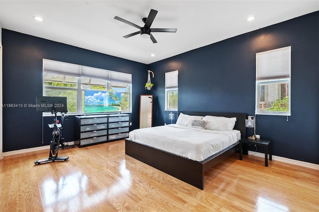 bedroom featuring ceiling fan and light hardwood / wood-style flooring