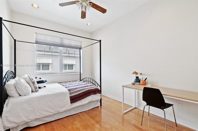 bedroom with wood-type flooring and ceiling fan