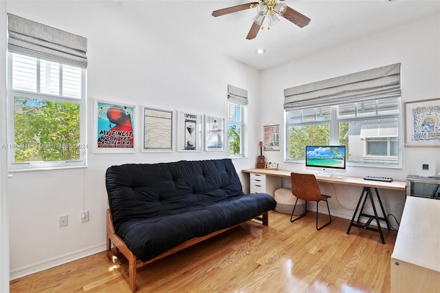 office space with ceiling fan, light wood-type flooring, and plenty of natural light