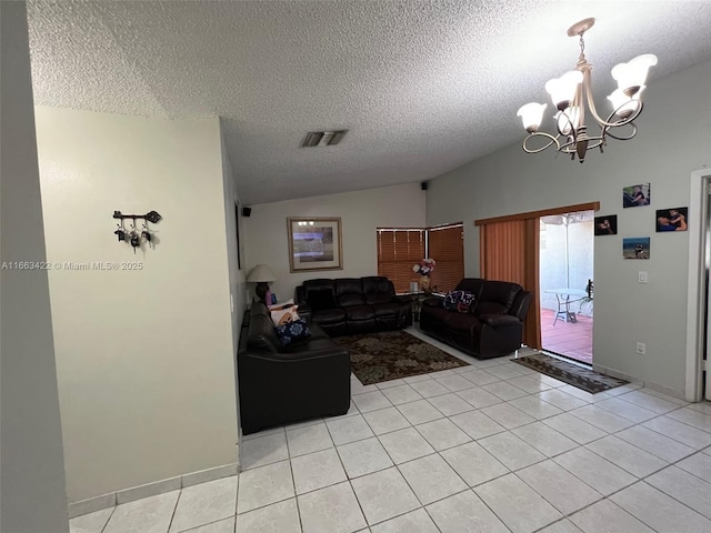 living area with an inviting chandelier, lofted ceiling, light tile patterned floors, and visible vents