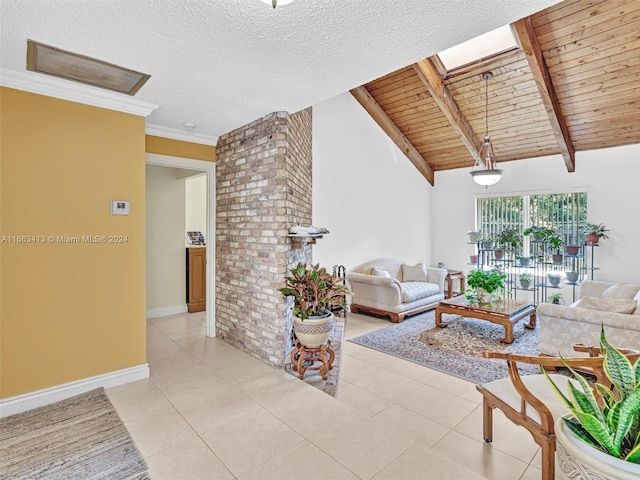 tiled living room with ornamental molding, lofted ceiling with skylight, and wooden ceiling