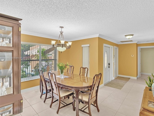 dining area featuring a textured ceiling, ornamental molding, and plenty of natural light