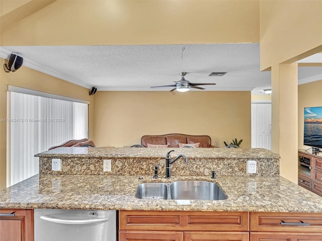 kitchen with ceiling fan, dishwasher, light stone countertops, and sink