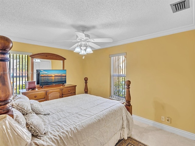 tiled bedroom with a textured ceiling, crown molding, and ceiling fan