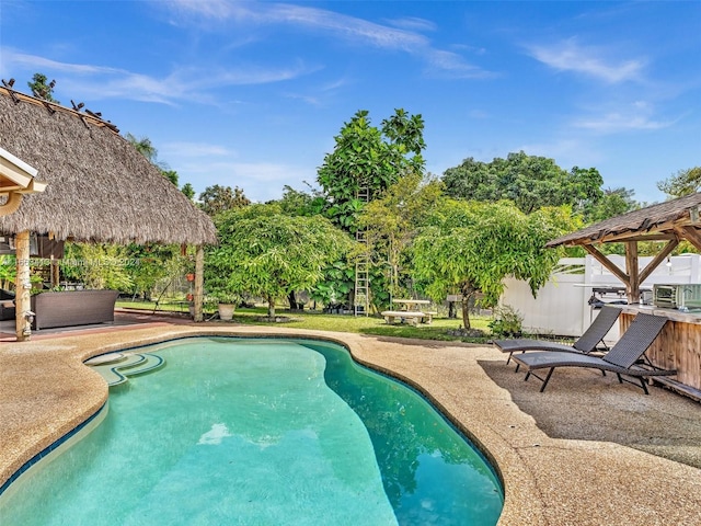 view of pool featuring a gazebo and a patio