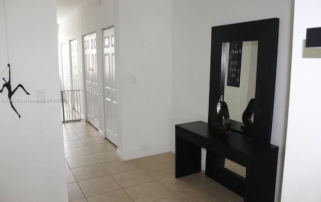 corridor with light tile patterned floors