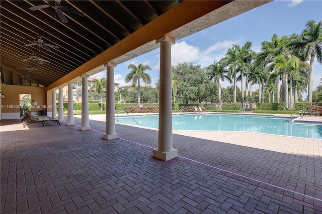 view of pool featuring ceiling fan and a patio area