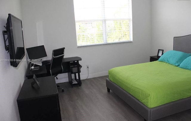 bedroom featuring dark wood-type flooring