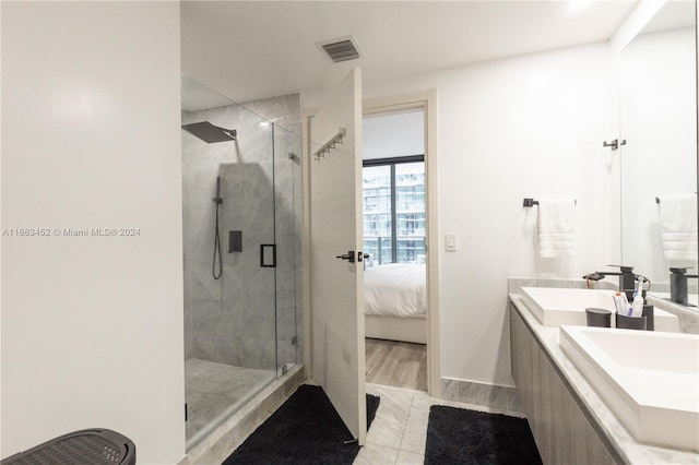 bathroom featuring vanity, a shower with shower door, and hardwood / wood-style flooring