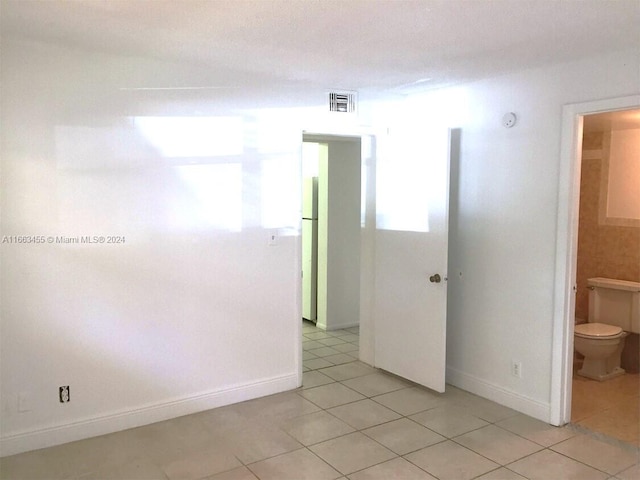 view of tiled spare room